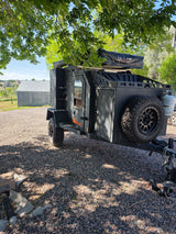 Experience off-grid camping! This rugged off-road camper with a rooftop tent is ideal for your next RV rental.