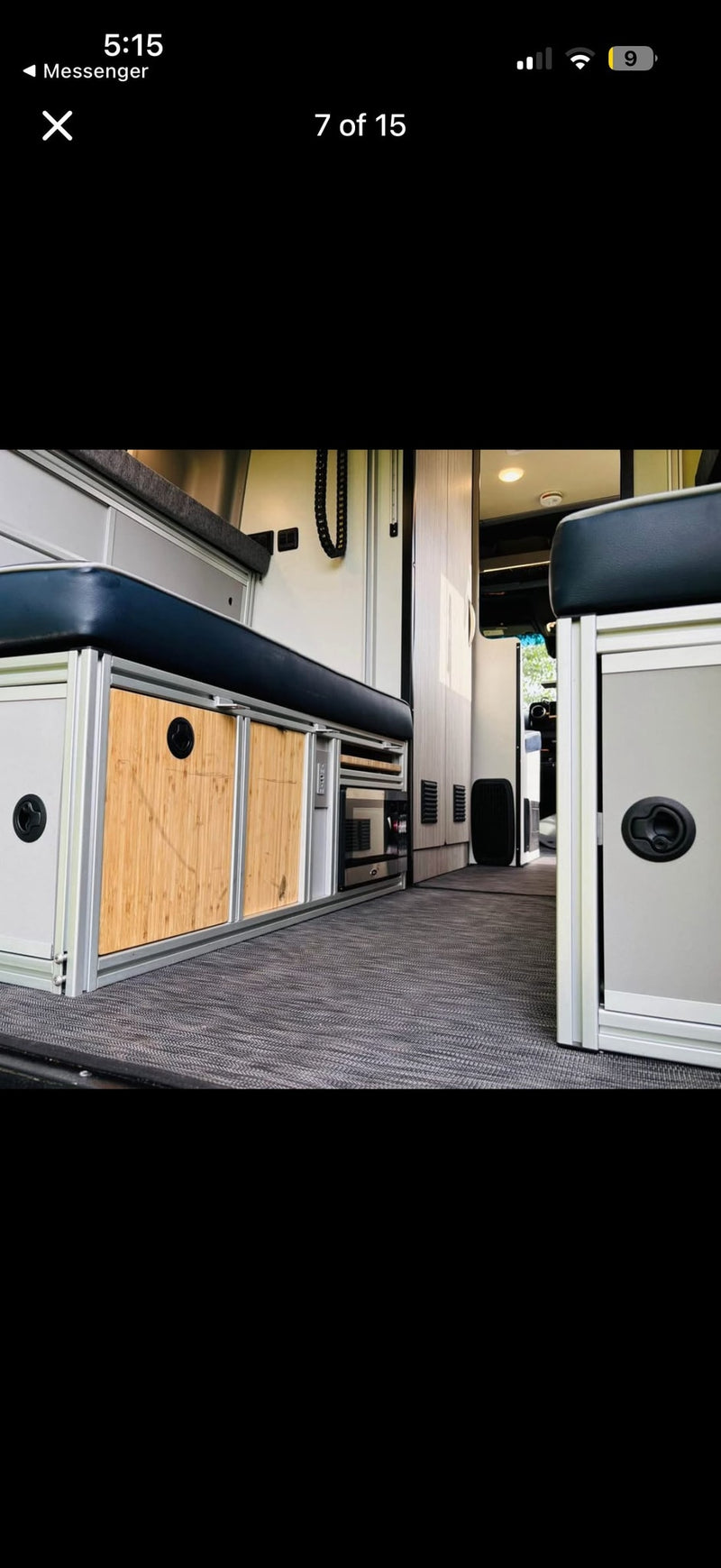 Explore this rv rental's functional interior: custom bamboo cabinets, a sleek kitchenette, and comfortable bench seating for your road trips. — photo 11