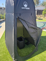 Black Wakeman Outdoors privacy tent with portable toilet inside, great for rv rental, camping, or an outdoor shower.
