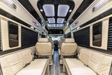 Luxury rv rental interior showcasing plush cream seats, wood accents, and ambient lighting for upscale, comfortable travel.