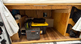RV rental storage with a Jackery power station, Victron electrical system, and custom wood paneling. Ideal for off-grid adventures.