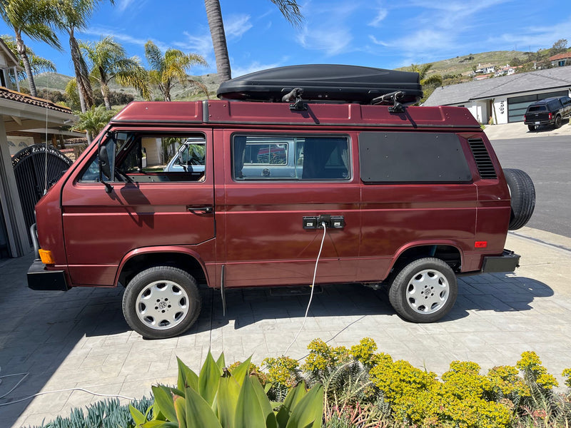  ready with a roof box and power.|A vibrant red VW Westfalia camper van — photo 1
