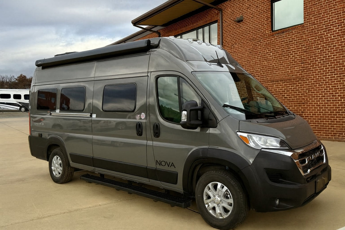 Sleek gray Nova Class B RV with an awning