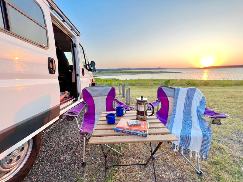 Serene sunset from an RV rental, with coffee, books, and cozy chairs by the lake. A perfect evening escape. — photo 4