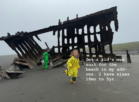 RV rental adventures: Kids in mud suits explore a shipwreck on the beach.