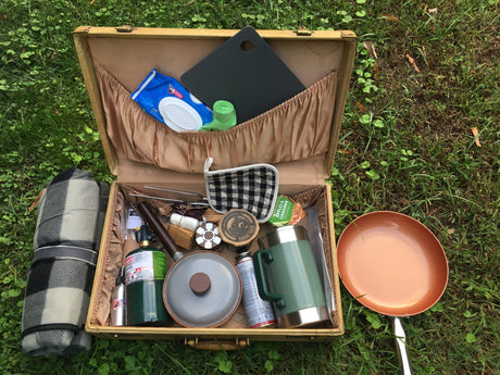 This organized camping gear and outdoor cooking kit, packed in a suitcase, is perfect for any RV rental trip. Includes pan & blanket.