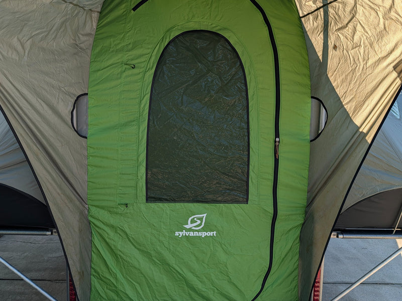  with a roof rack and open utility bed.|SylvanSport GO pop-up camper trailer for RV rental. Modern gray & green design with roof rack — photo 7