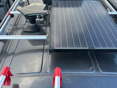 RV rental roof: Black Starlink satellite dish and large solar panel, ideal for off-grid power and internet.