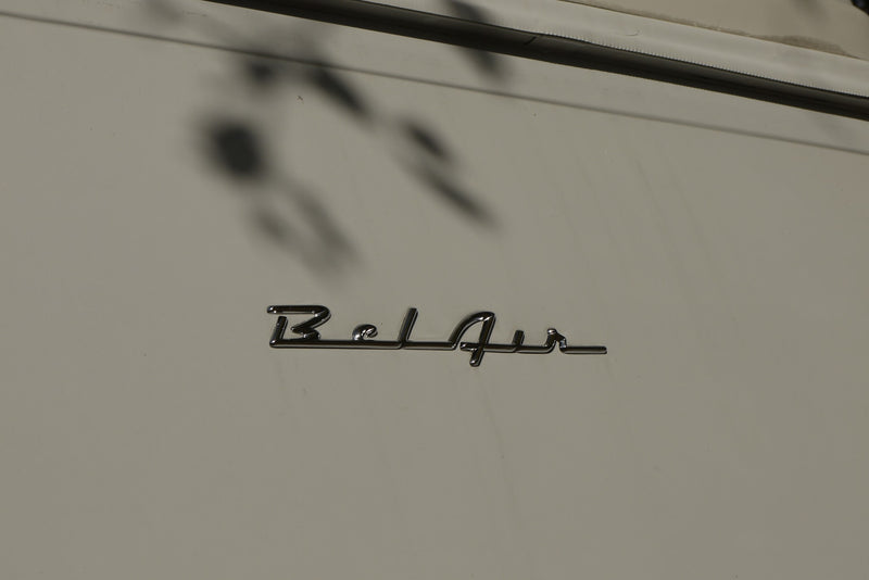  with a chrome winged hood ornament & wipers. Trees reflect in the windshield.|Sleek chrome hood ornament — photo 4