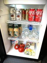 This rv rental mini-fridge is stocked with Barq's, Coke, Starbucks, water, Coffee-mate, fresh tomatoes, and pre-cut veggies.