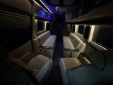 Experience luxury in our RV rental! Spacious interior with comfortable, quilted seating, cup holders, and ambient lighting.