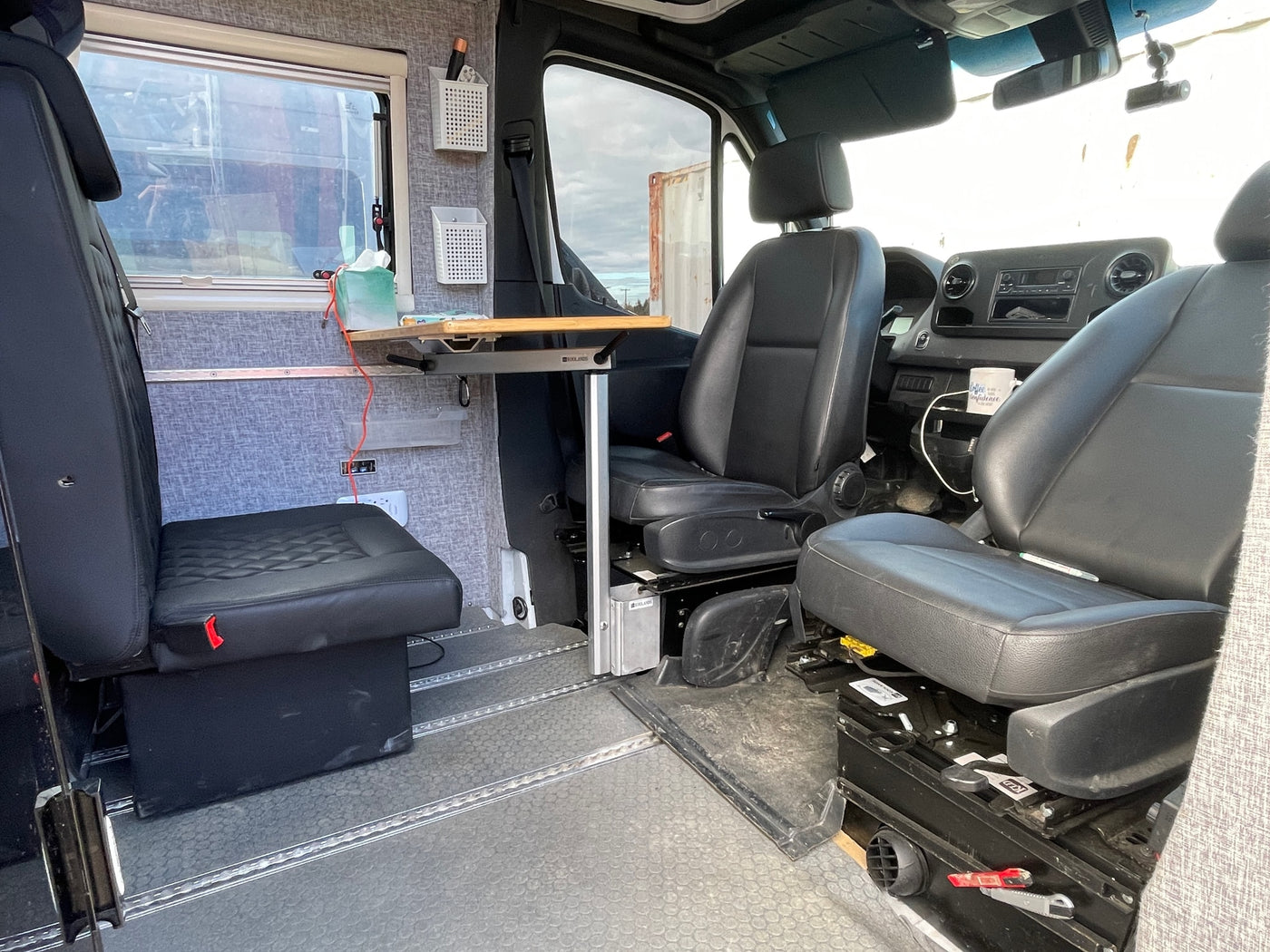  and adjacent bunk area. Essential amenities for your travels.|Compact RV rental bathroom with toilet — photo 12