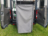 RV rental with a convenient rear privacy tent, perfect for an outdoor shower or changing room.