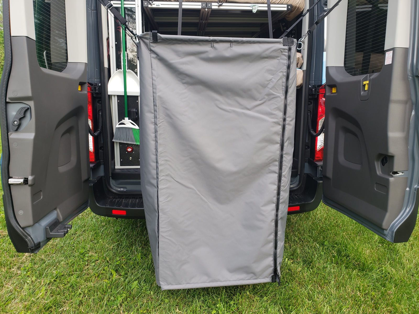 RV rental with a convenient rear privacy tent, perfect for an outdoor shower or changing room.