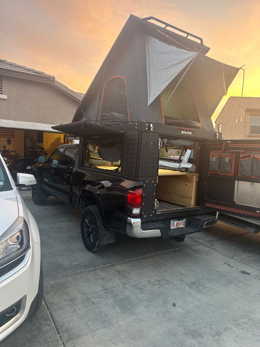  and hanging organizers. Ready for travel.|Family inside an RV rental truck camper