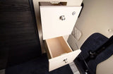 RV rental storage: Open drawers with light wood in a motorhome, featuring a locking top drawer and quilted interior.