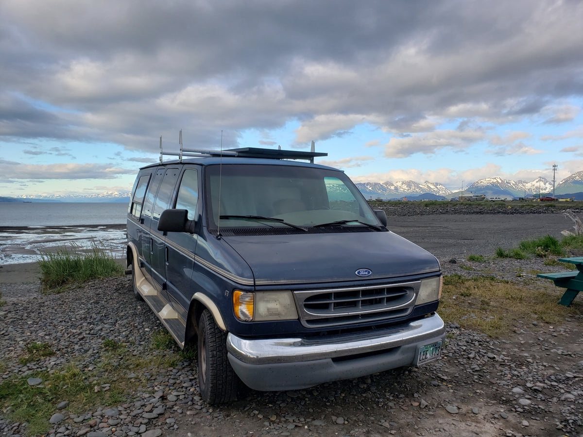 A blue Ford van