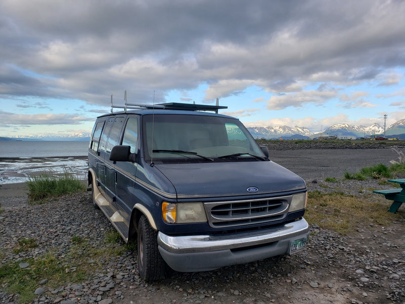 A blue Ford van — photo 1