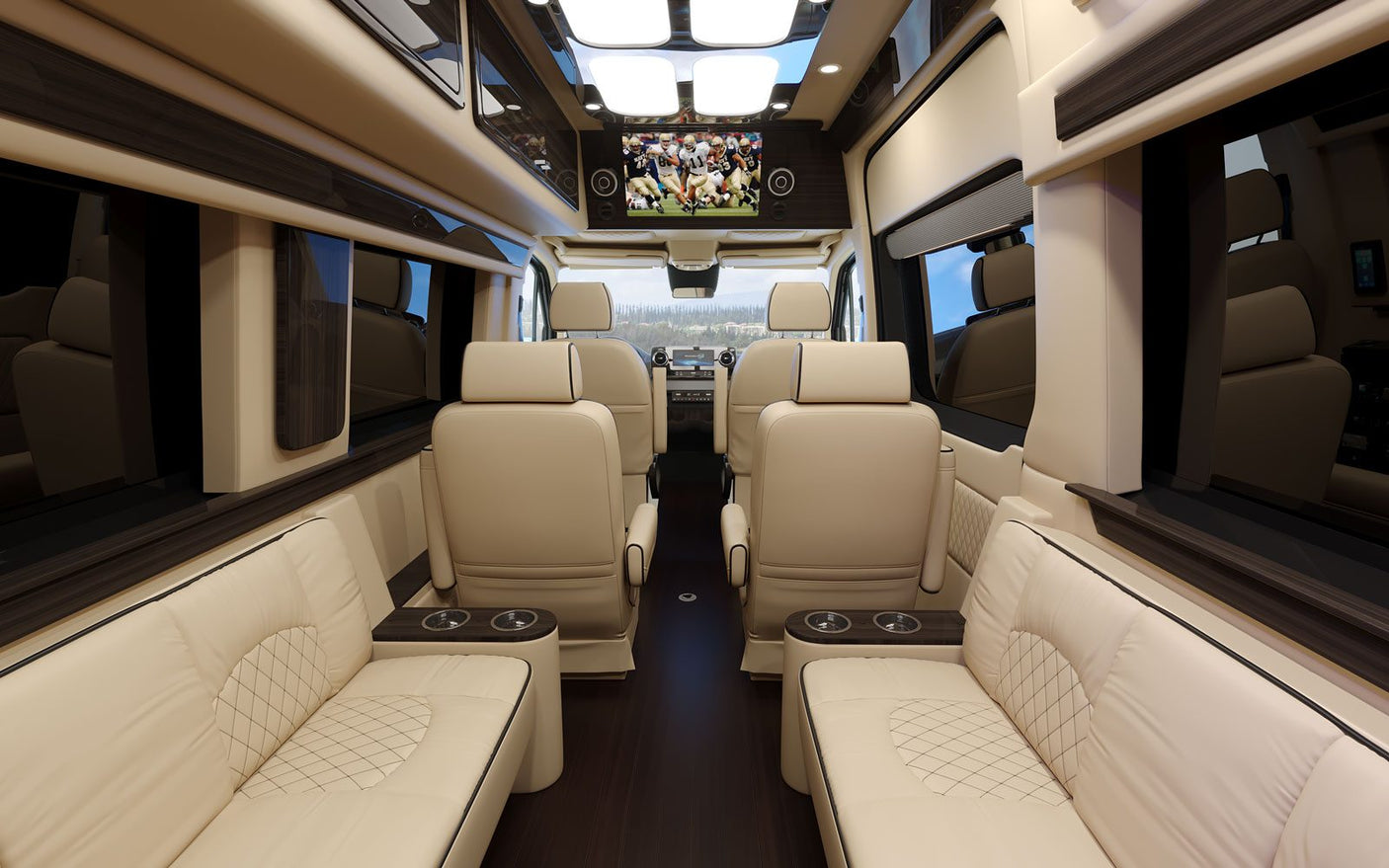 Step inside this luxurious RV rental: a spacious interior with comfortable leather seats and a large screen for entertainment.