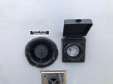 RV rental side showing fresh water connection, shore power electrical inlet, and furnace vent.