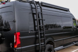 Sleek matte black Mercedes-Benz Sprinter RV rental van, equipped with a roof ladder, tinted windows, and rugged tires.