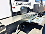 This RV rental features a convenient pull-out outdoor kitchen with a stove, sink, and prep space, perfect for camping adventures.