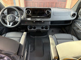 Spacious Mercedes-Benz van interior, perfect for an rv rental adventure. Features dashboard, steering wheel, and Storyteller Overland Beast Mode.