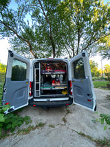 This custom camper van offers tiered bunks for travel. Ideal for your next RV rental adventure.