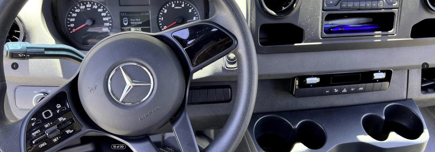 RV rental van interior: Mercedes-Benz steering wheel, dashboard, climate controls, and cupholders. "Key Not Detected" warning displayed. — photo 7