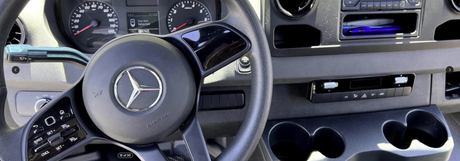 RV rental van interior: Mercedes-Benz steering wheel, dashboard, climate controls, and cupholders. "Key Not Detected" warning displayed.