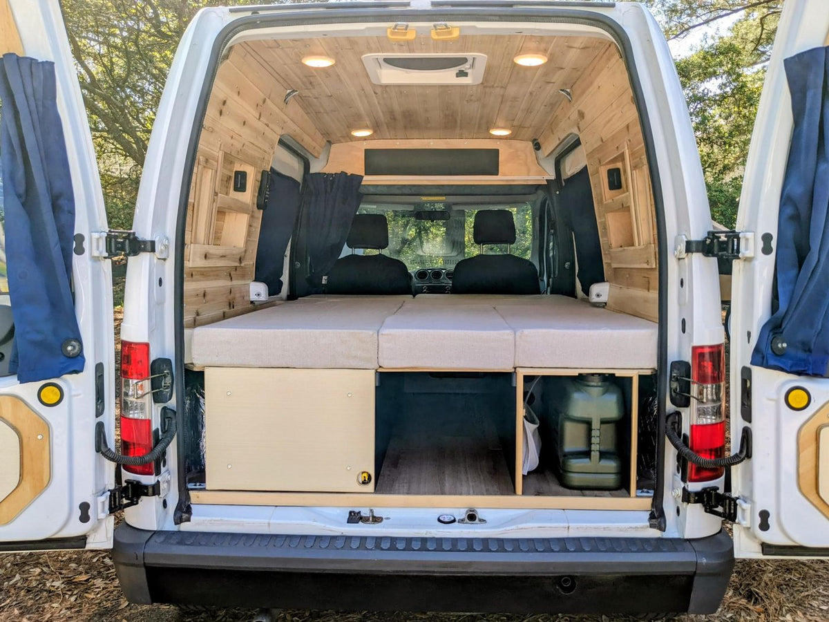  and scenic water view for your next adventure.|Step into this RV rental camper van: wood-paneled ceiling — photo 12