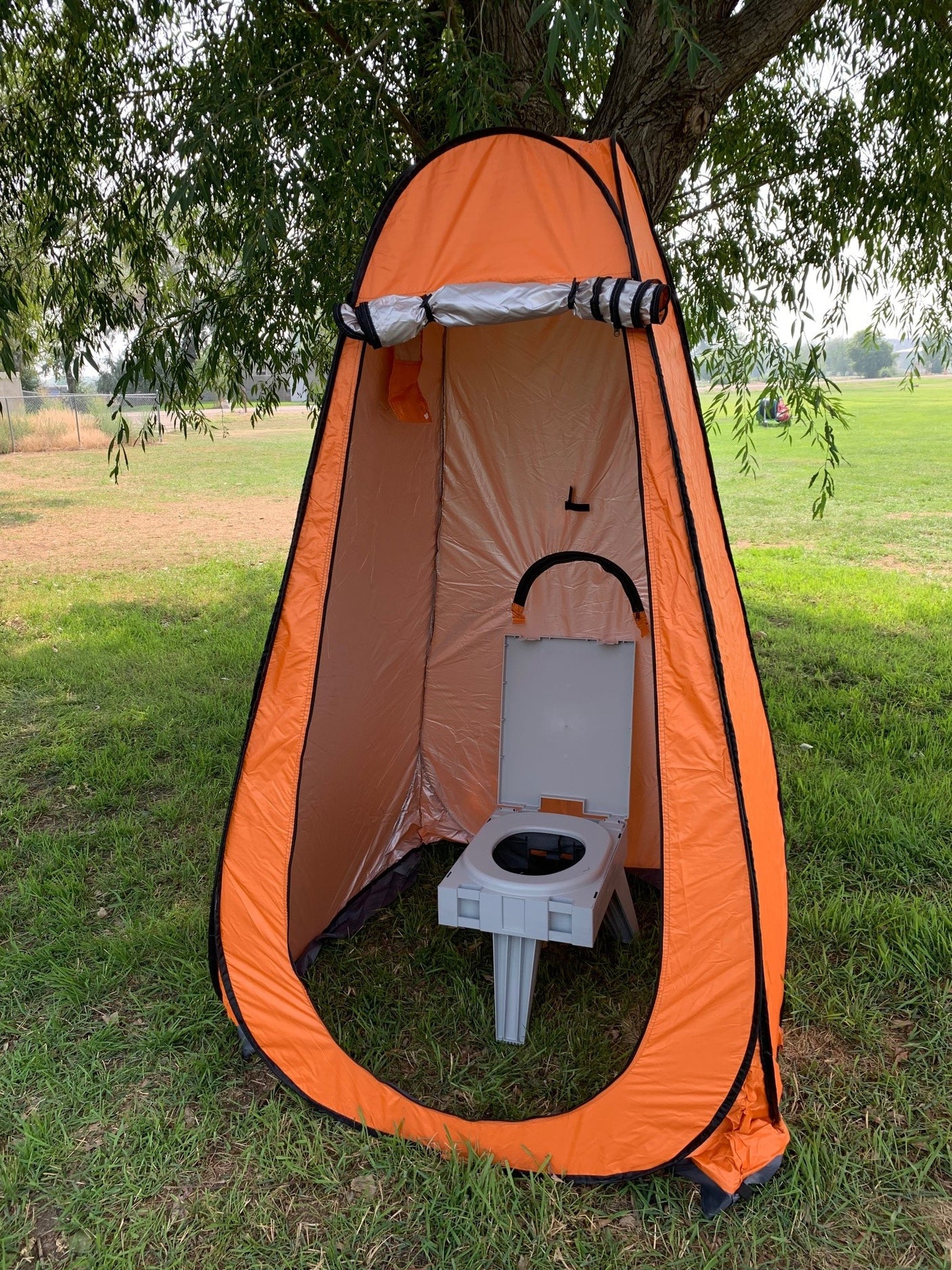Essential for any RV rental: portable privacy tent & toilet for outdoor camping bathroom needs.