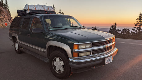 Scenic mountain sunset from a well-equipped SUV, an alternative to an RV rental for your next adventure.
