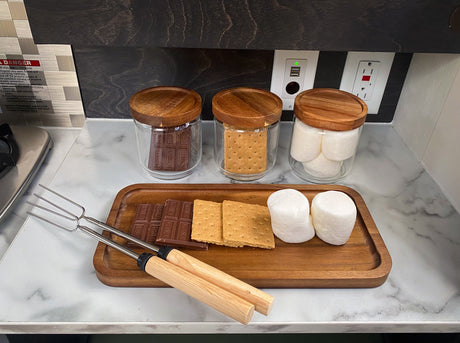Get ready for s'mores in your RV rental! Chocolate, graham crackers, marshmallows, and roasting forks displayed.