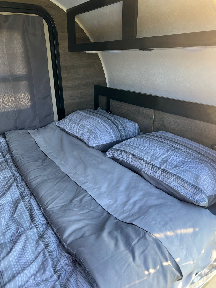  set for camping.|Step inside this cozy rv rental: large bed