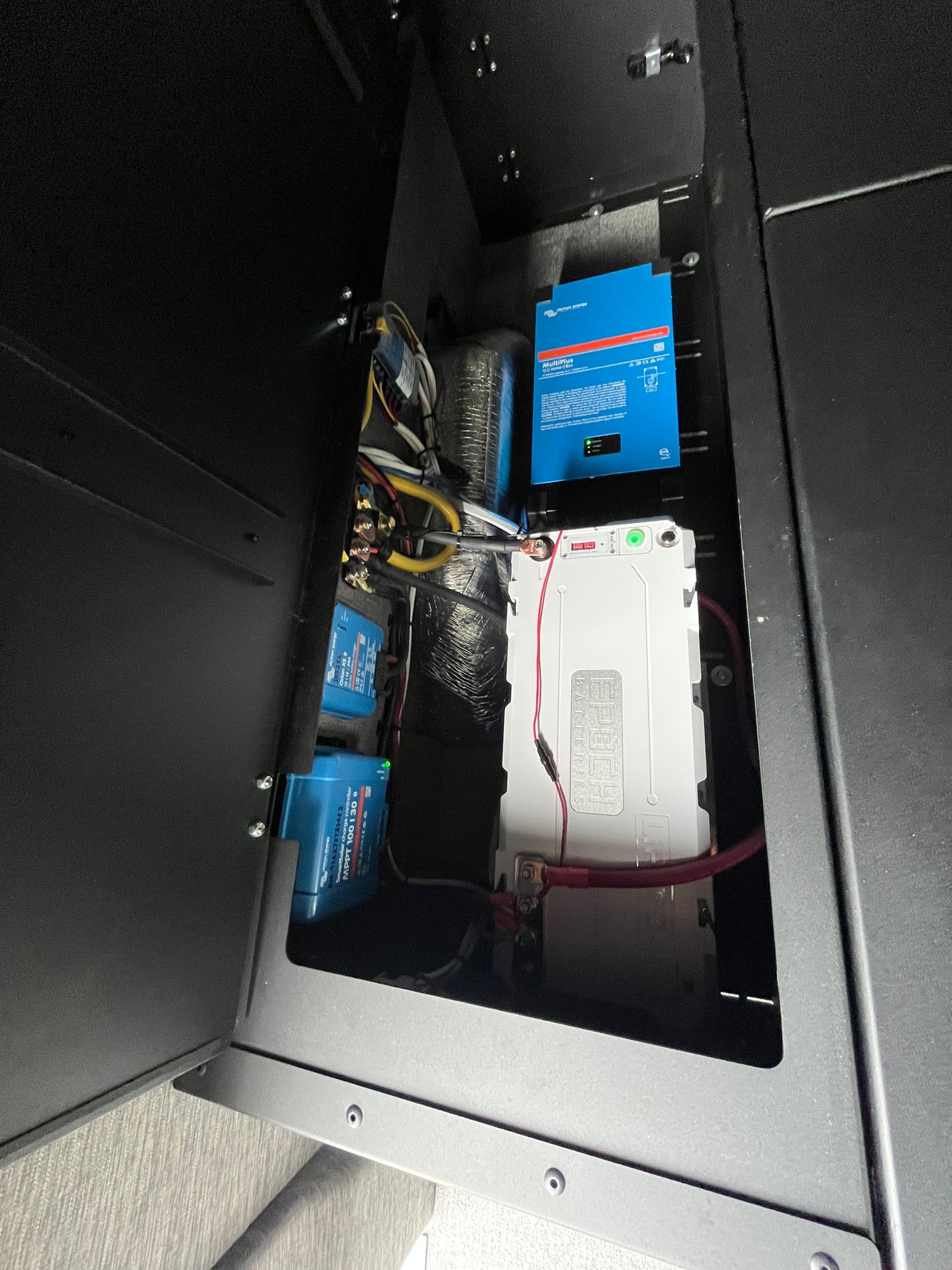 This RV rental compartment showcases a robust power system: Victron MultiPlus, SmartSolar, Orion, and an Epoch battery. — photo 7