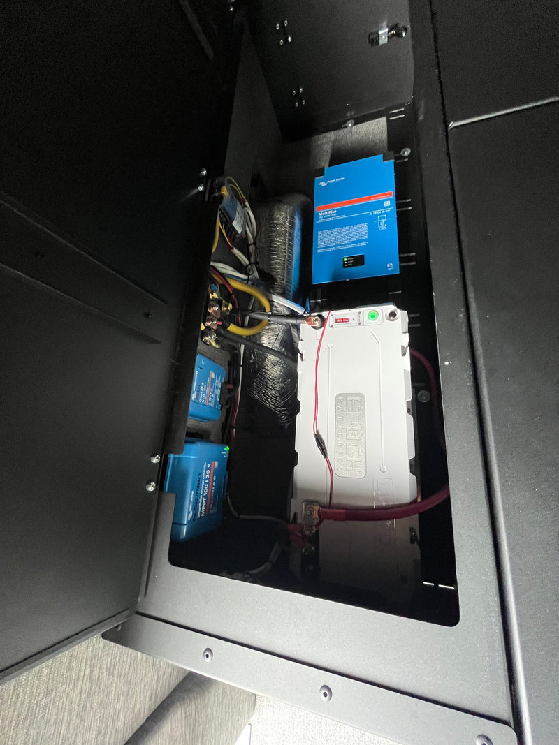 This RV rental compartment showcases a robust power system: Victron MultiPlus, SmartSolar, Orion, and an Epoch battery. — photo 7