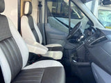 Spacious RV rental interior: two-tone front seats and dashboard, ready for your next adventure.