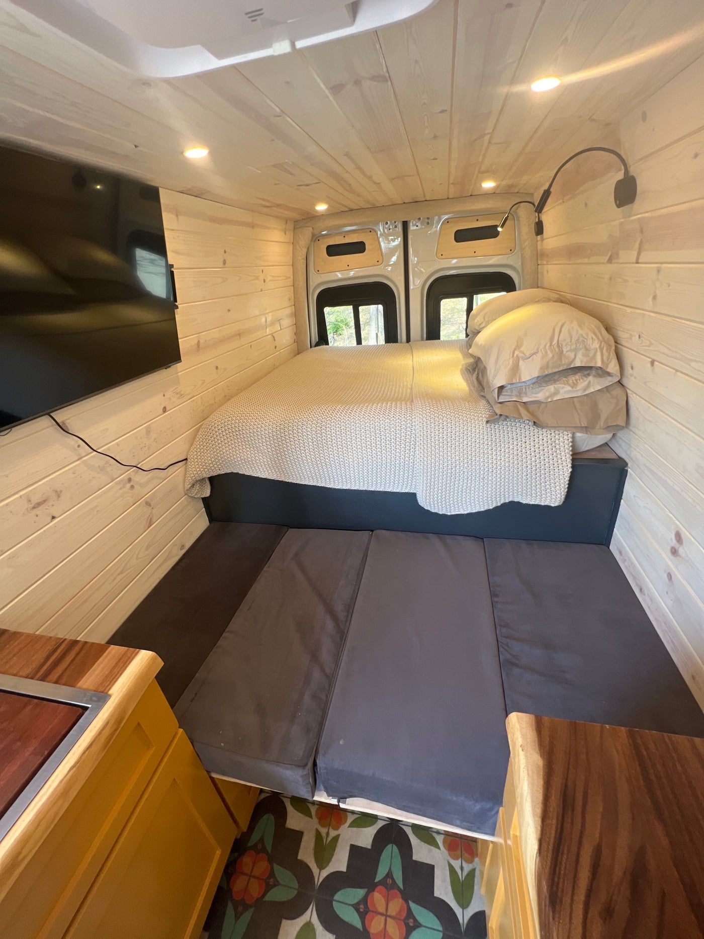  and three passenger seats.|Inside this bright rv rental: wood-paneled walls — photo 10