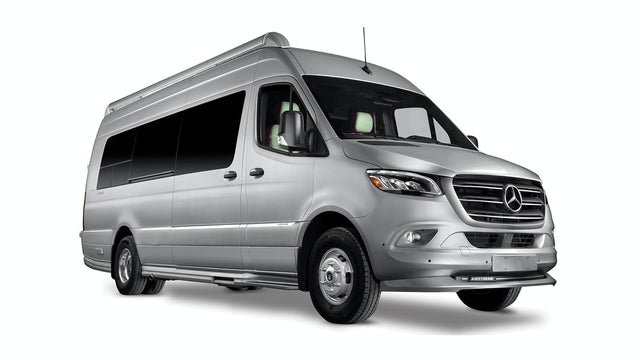  and a window with an outdoor view.|Silver Mercedes-Benz Sprinter camper van. Explore with this sleek RV rental motorhome.|Silver Mercedes-Benz Sprinter RV rental. This spacious camper van is set up for outdoor adventures.|Bright