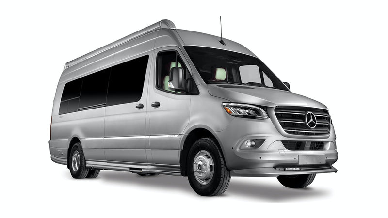  and a window with an outdoor view.|Silver Mercedes-Benz Sprinter camper van. Explore with this sleek RV rental motorhome.|Silver Mercedes-Benz Sprinter RV rental. This spacious camper van is set up for outdoor adventures.|Bright — photo 1