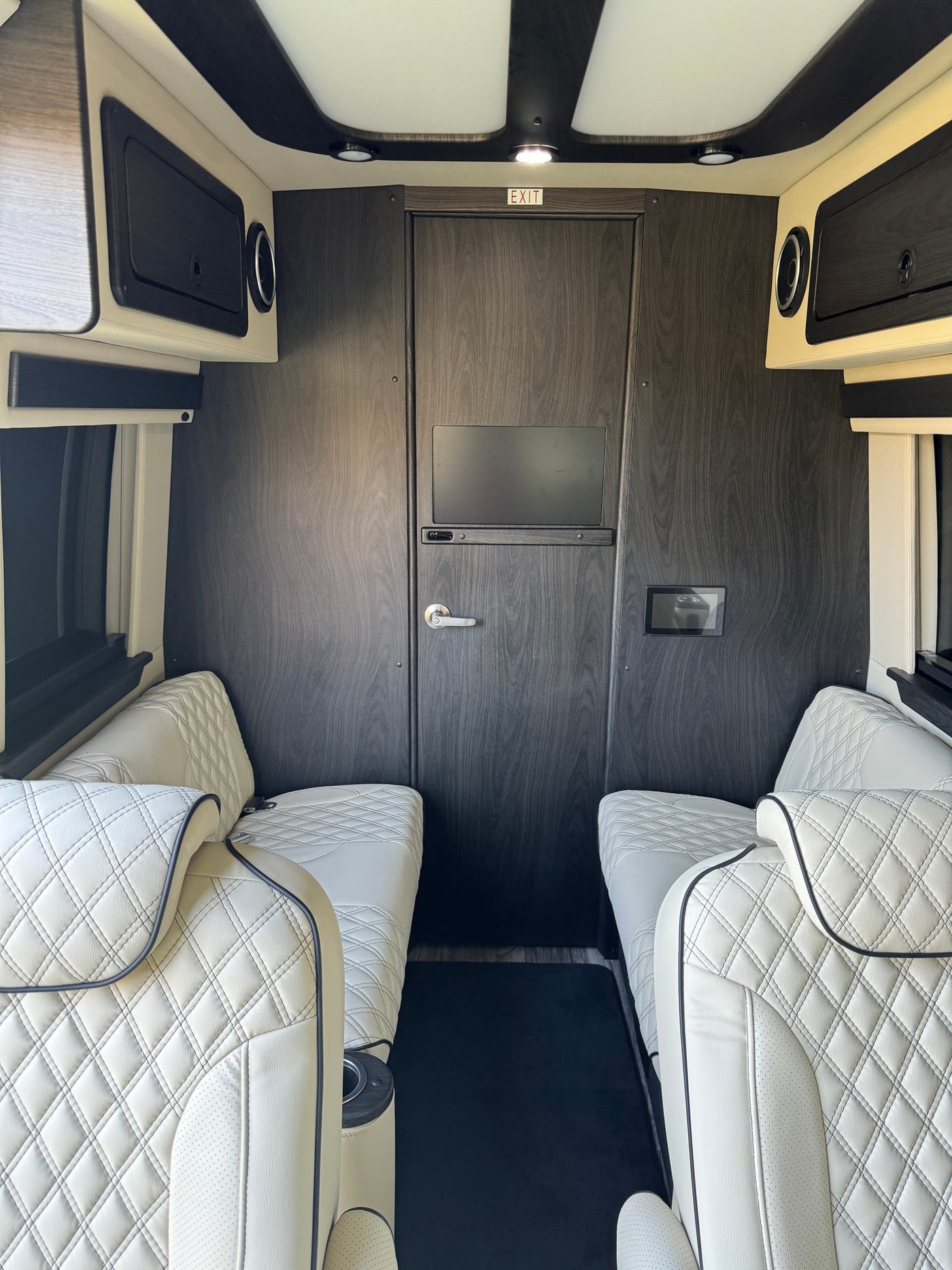  and trailer hitch.|Luxury RV rental interior with cream quilted seats — photo 6