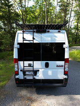 White Ram ProMaster camper van, an ideal RV rental, equipped with a roof rack and rear ladder for outdoor exploration.