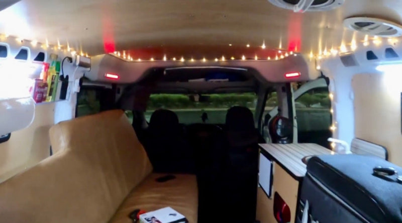  and chairs set up. Ideal for an rv rental adventure.|Cozy RV rental interior showing a bed — photo 10