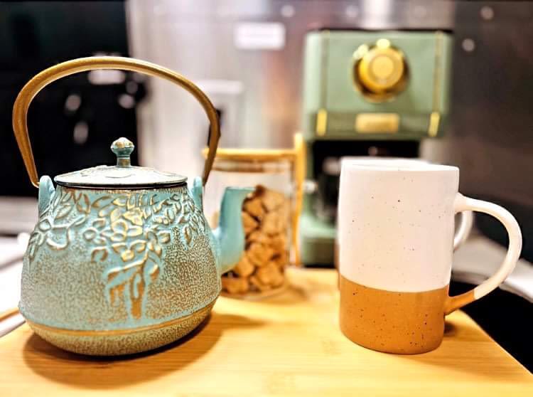  and mugs on a wooden board.|RV rental: A well-stocked shelf with Act II popcorn — photo 8