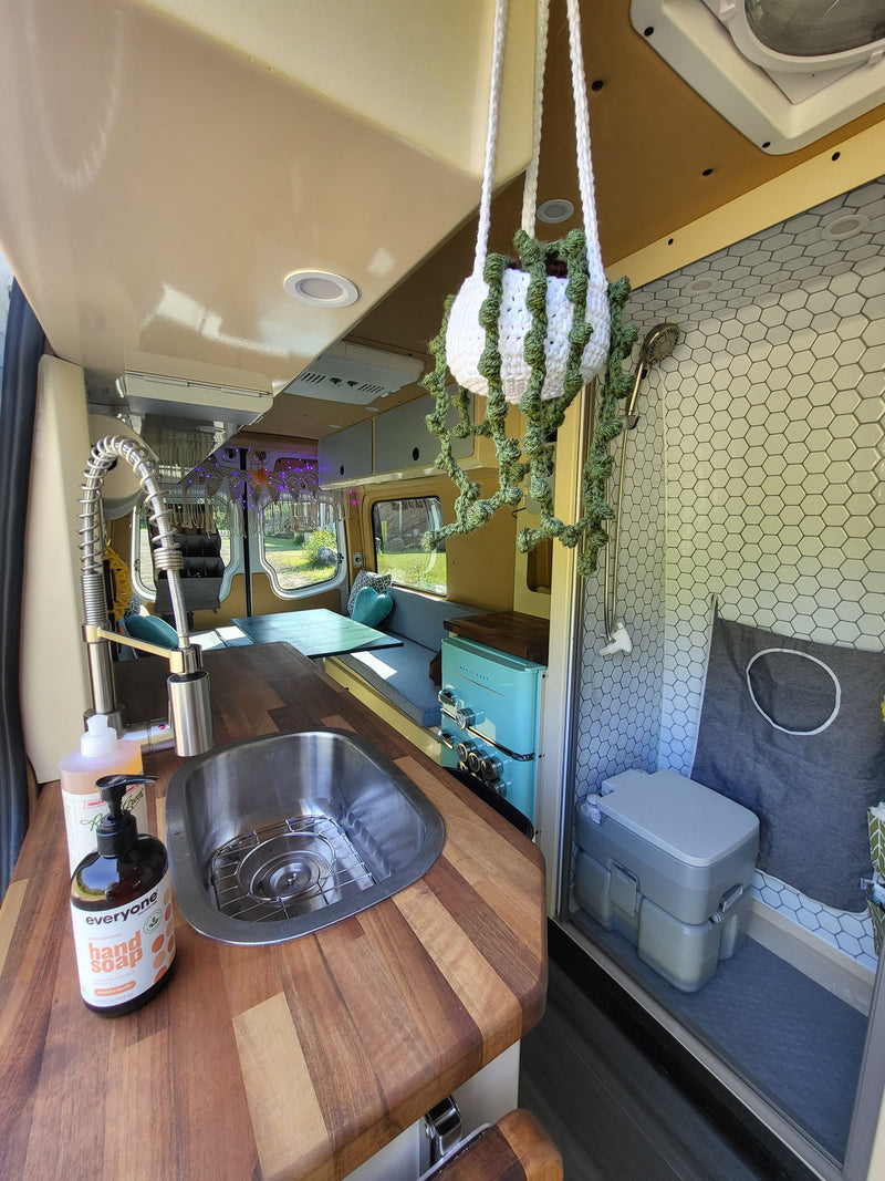  and portable stove. Smart storage for an rv rental adventure.|Inside an RV rental: view from the living area towards the driver's cabin — photo 8
