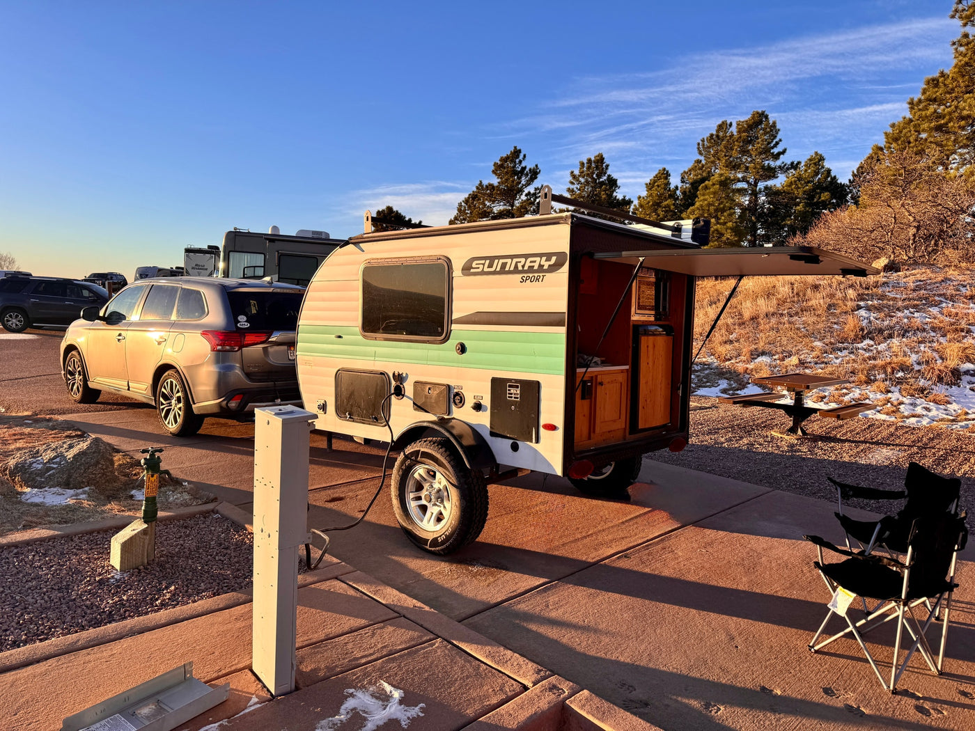 This Sunray Sport teardrop RV rental is set up for camping, showcasing its open kitchen. Perfect for outdoor adventures. — photo 3