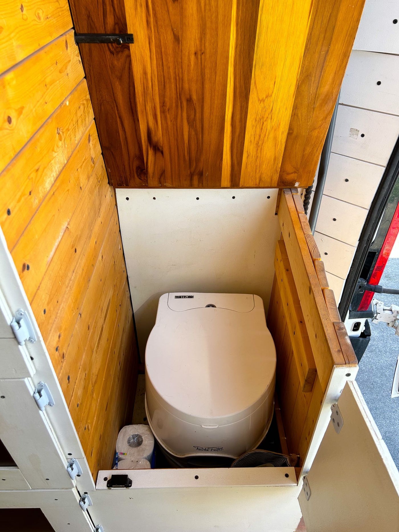  & small window.|An RV rental's clever built-in closet features a hanging rod — photo 11