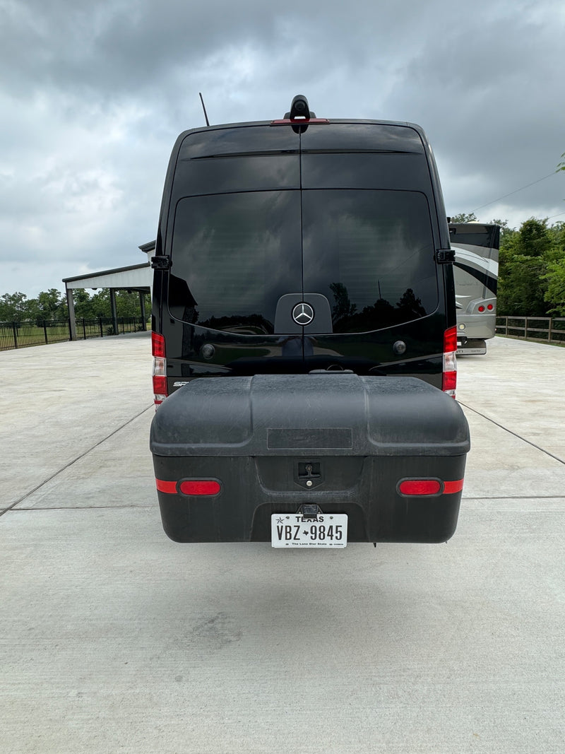 Luxury black Mercedes Sprinter camper van RV rental, equipped with a rear cargo box for extra storage. — photo 3