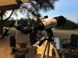A Gskyer telescope is set for stargazing on an RV rental trip, ideal for celestial camping views.
